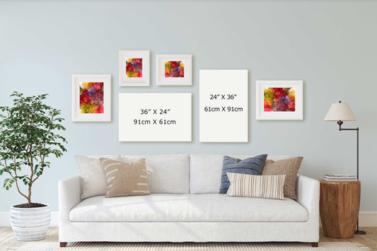 A staged living room scene showing a white sofa with decorative pillows, a potted plant, a floor lamp, and five framed wall art prints arranged above the couch.