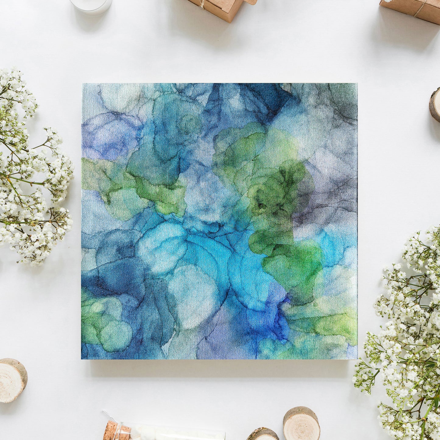 Digital mockup from above of Splash with baby's breath and small trinkets.