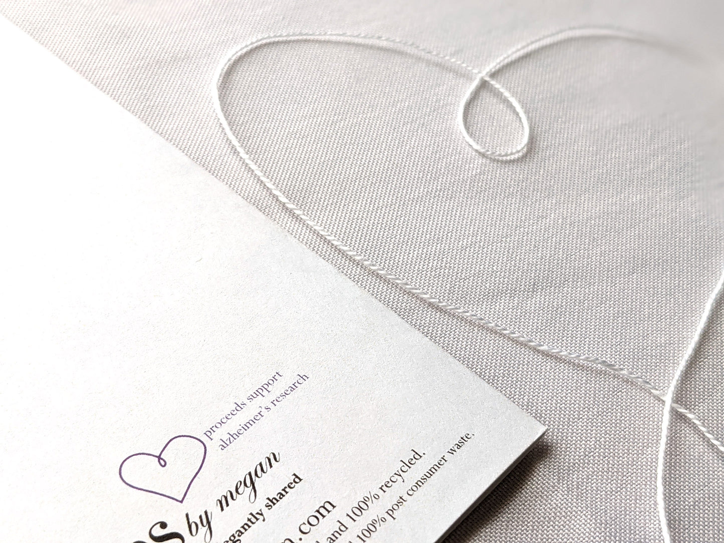 Back of greeting card showing the give back program.