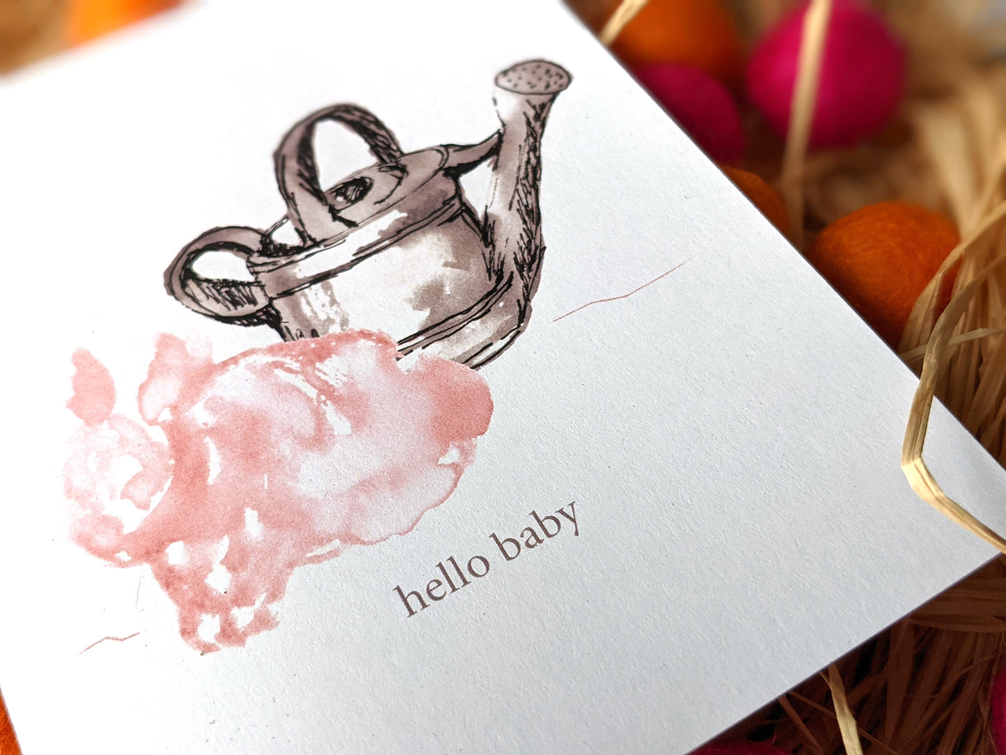 Zoomed in detail of hand painted bunny and watering can.