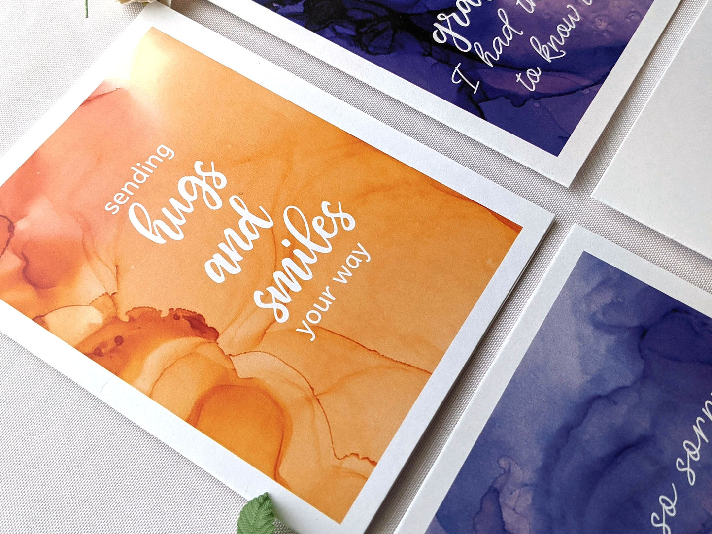Angled view from above of greeting card next to others from the collection.