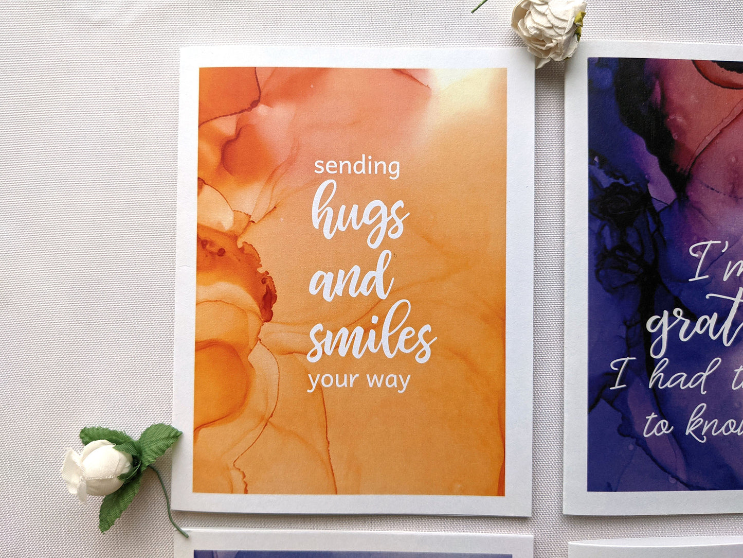 View from above of greeting card next to another from the collection.