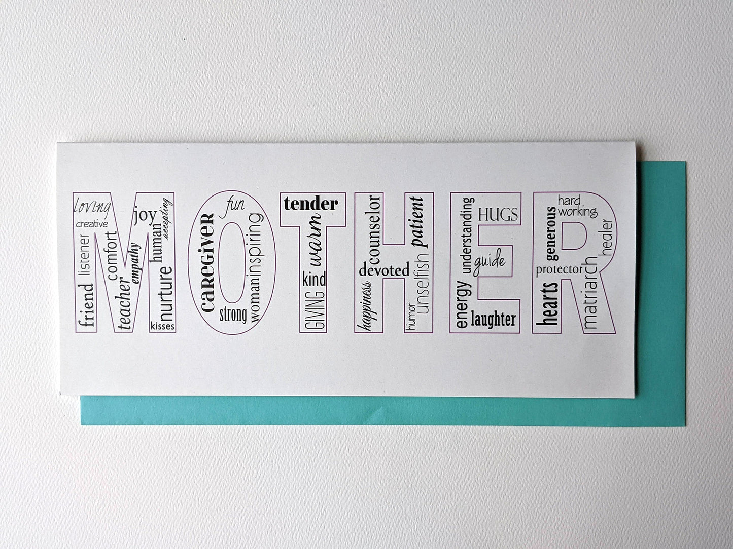 Greeting card and envelope laying on a white background.