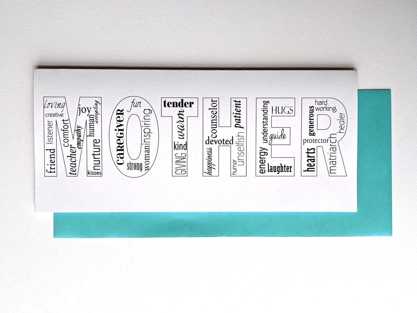 Greeting card and envelope laying on a white background.