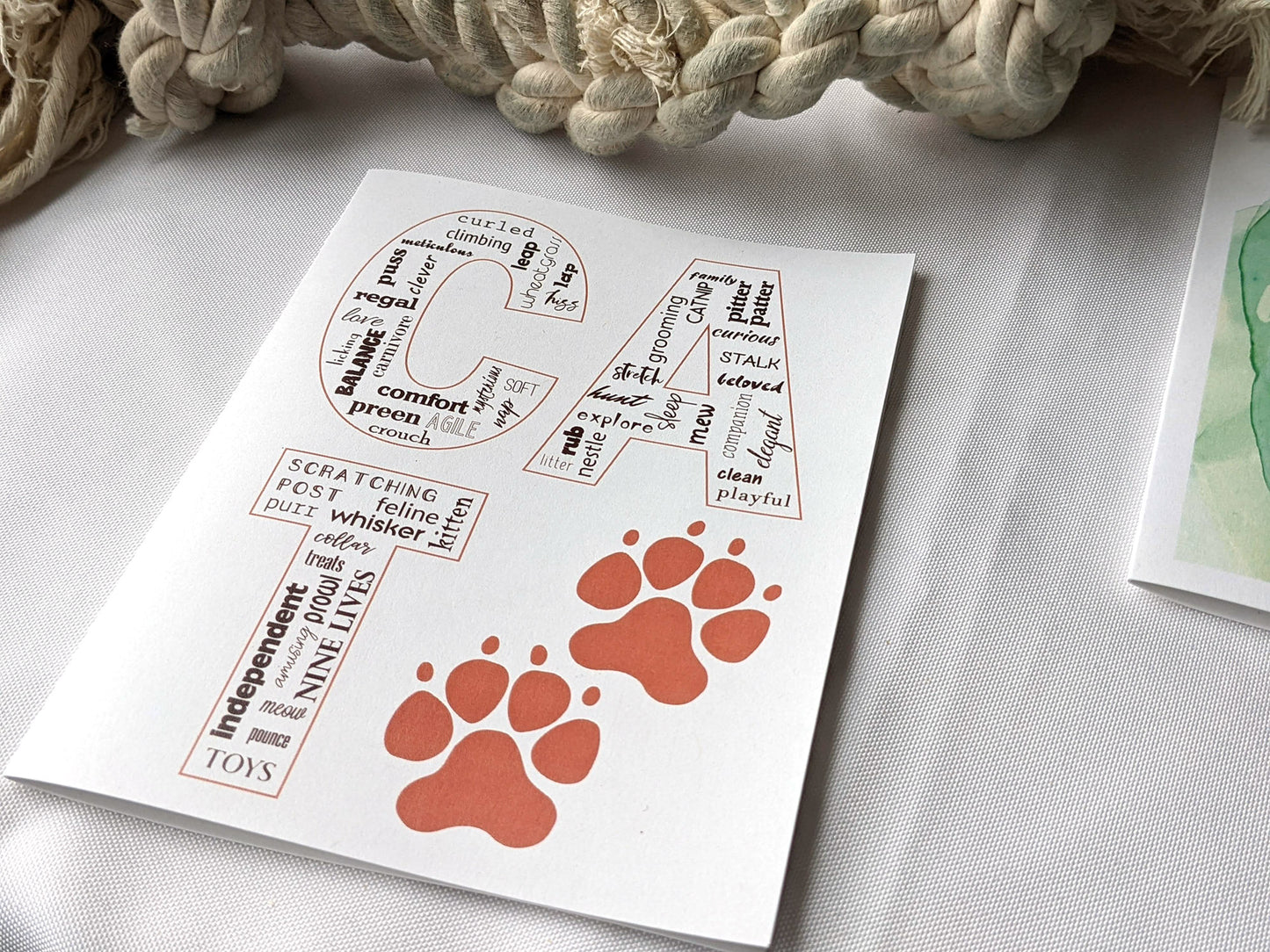 Angled view from above of greeting card next to others from the collection.