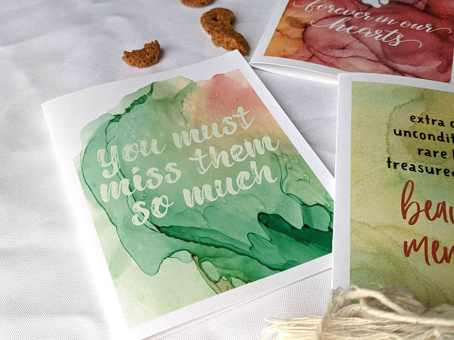 Angled view from above of greeting card next to others from the collection.