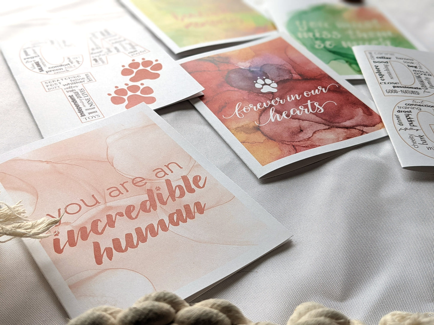 Angled view from above of greeting card next to others from the collection.