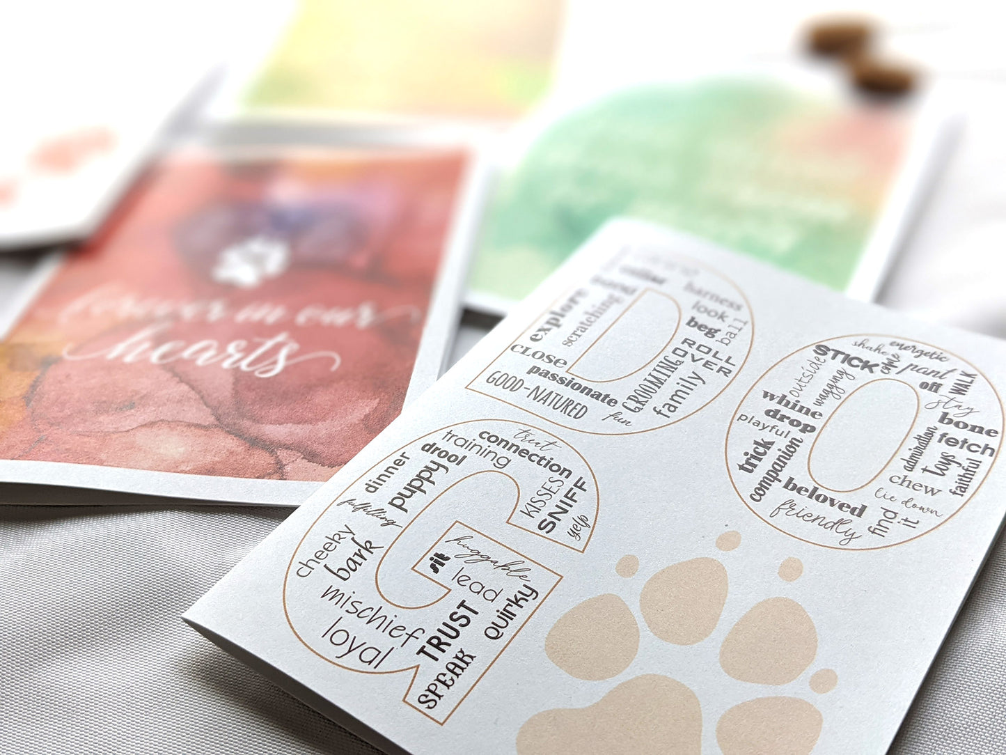 Angled view from above of greeting card next to others from the collection.