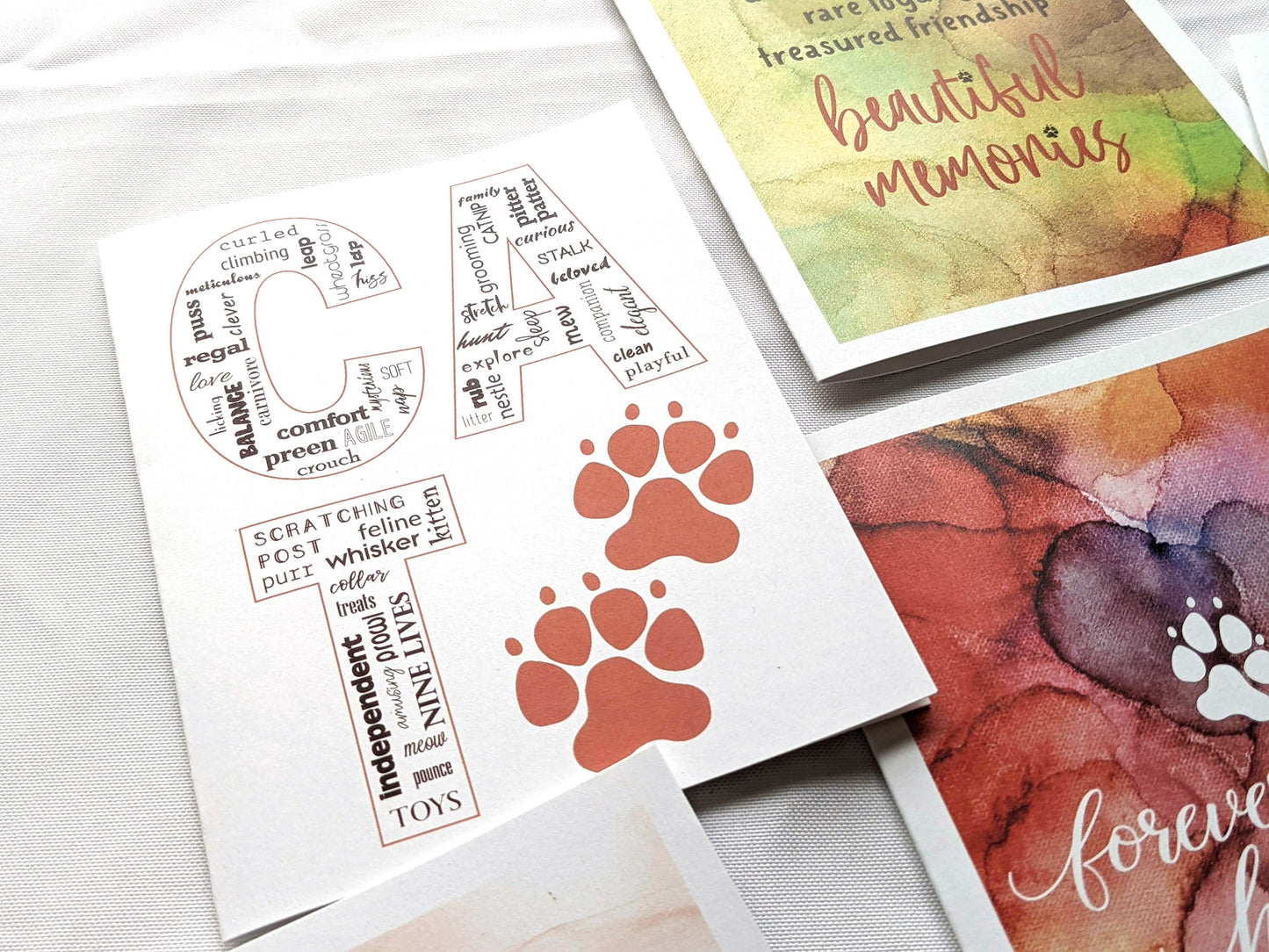 Angled view from above of greeting card next to others from the collection.