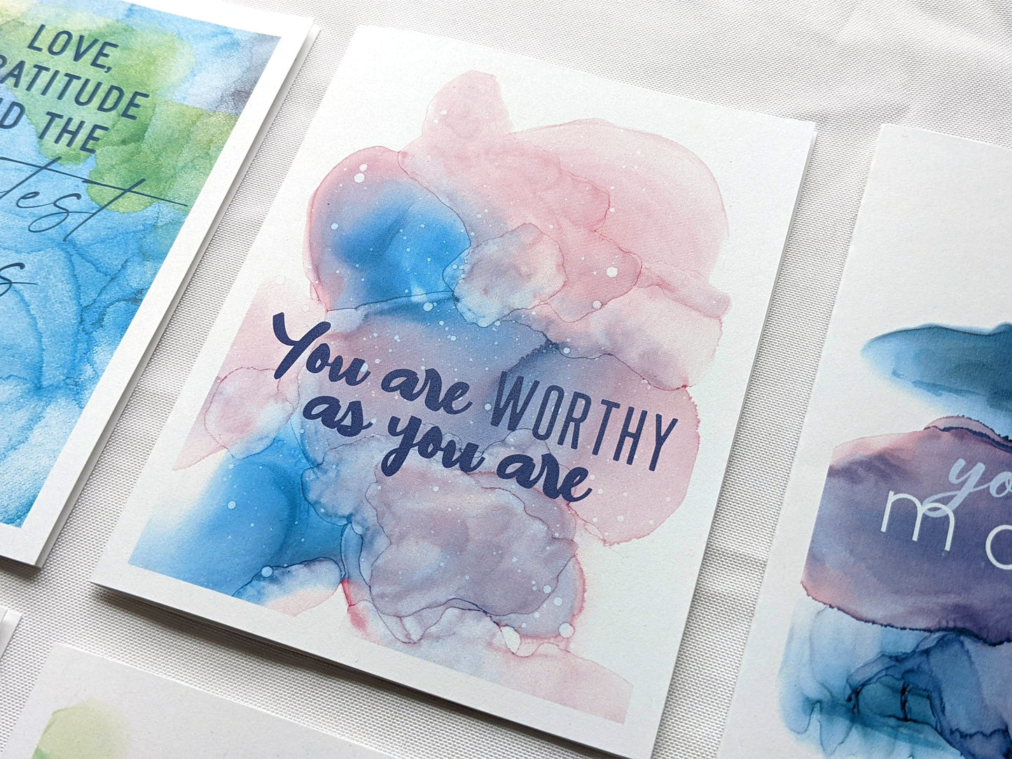Angled view from above of greeting card next to others from the collection.