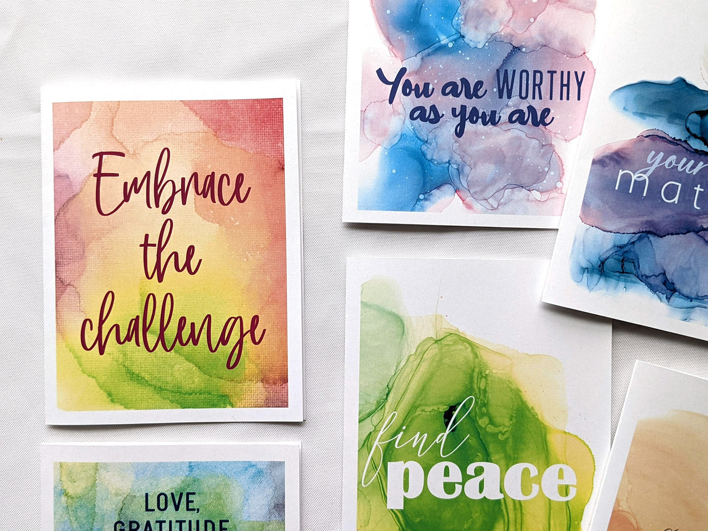 6 greeting cards laying on a white background.