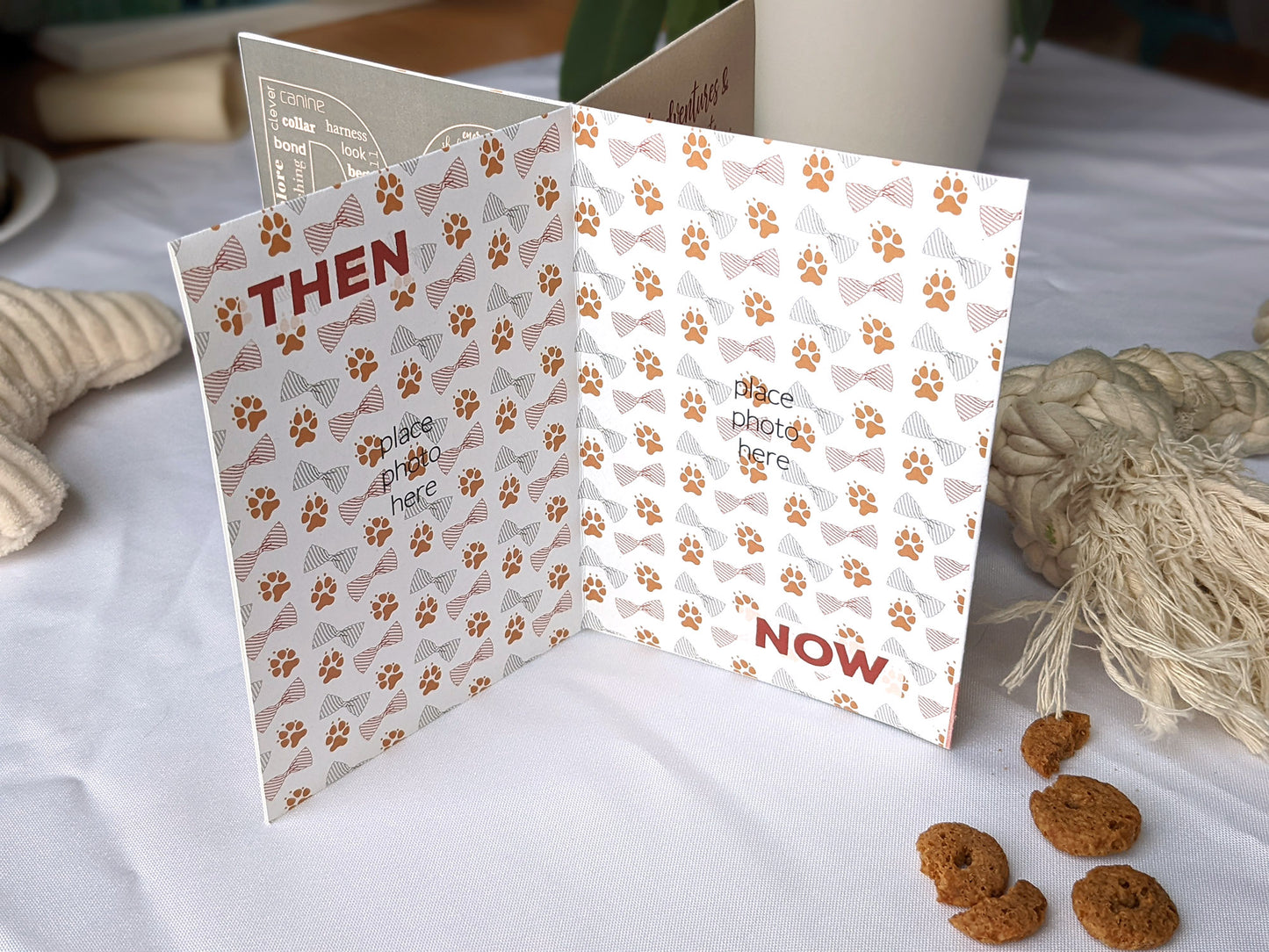 Lifestyle photo of centerpiece with dog toys and treats surrounding it showing the wording on the panels.