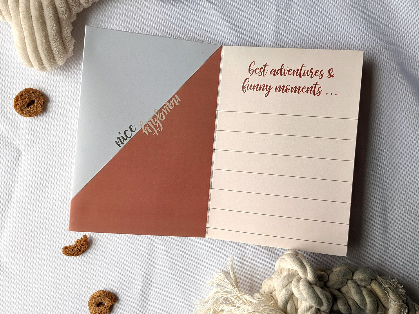 Flatlay of centerpiece showing the graphic design of two panels with dog toys and treats surrounding it.