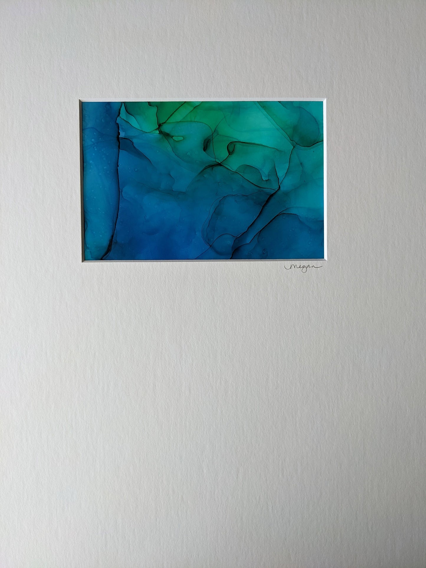 Painting shown with white mat.