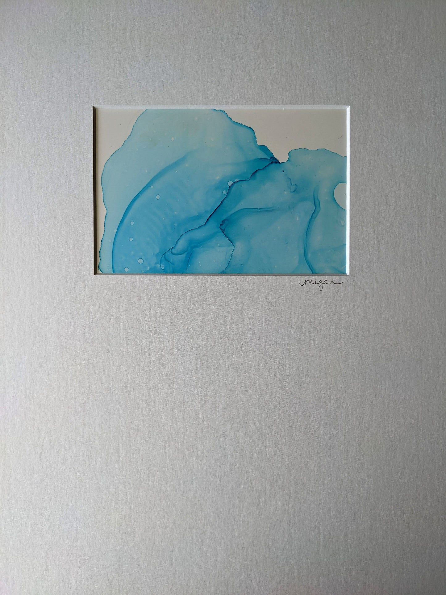 Painting shown with white mat.