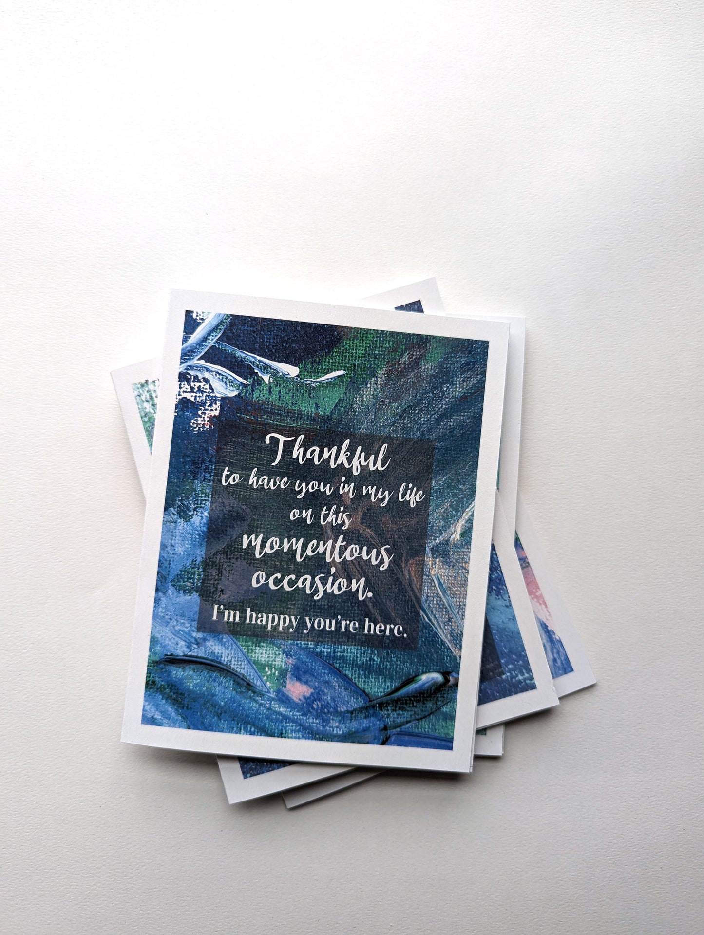 Stack of greeting cards on a white background.