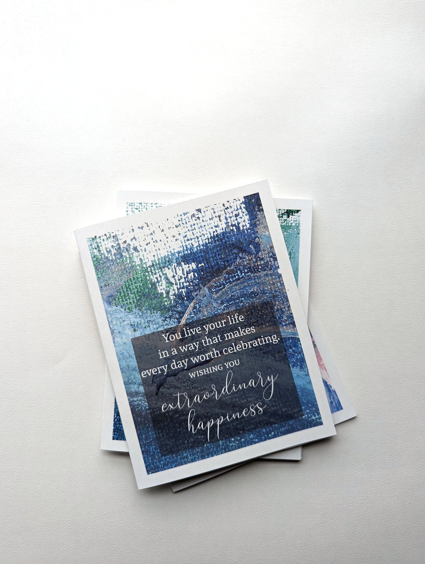 Stack of greeting cards on a white background.