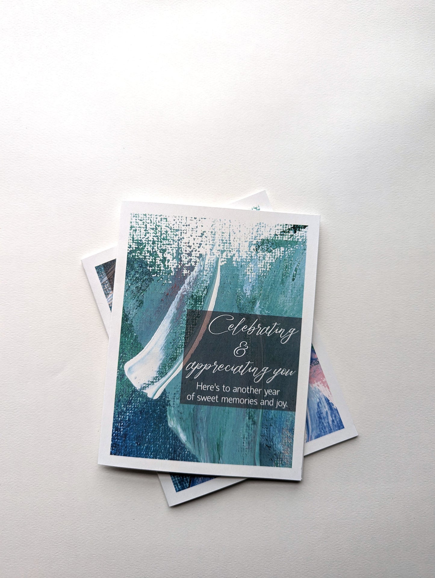 Stack of greeting cards on a white background.