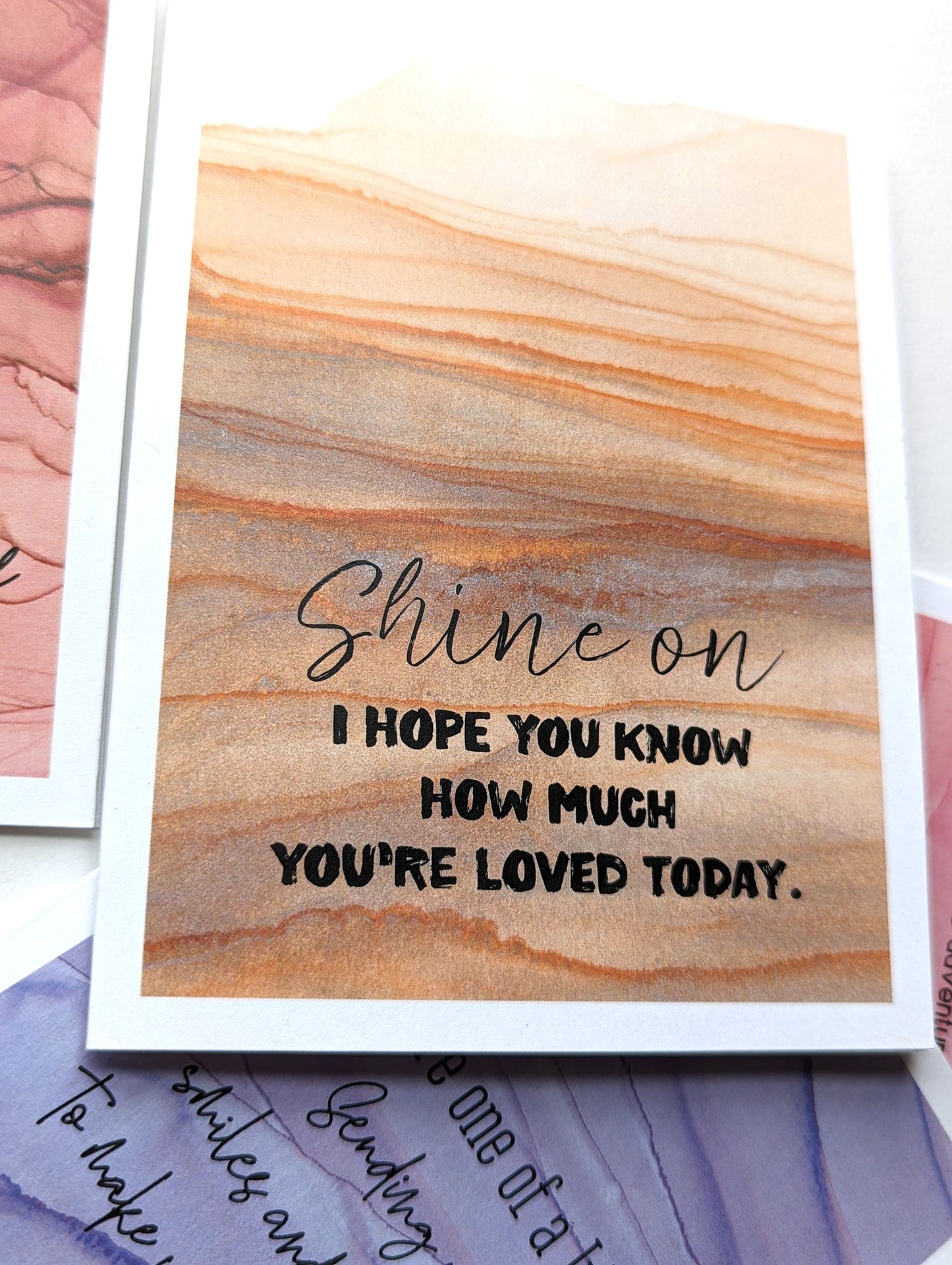 Stack of greeting cards on a white background.