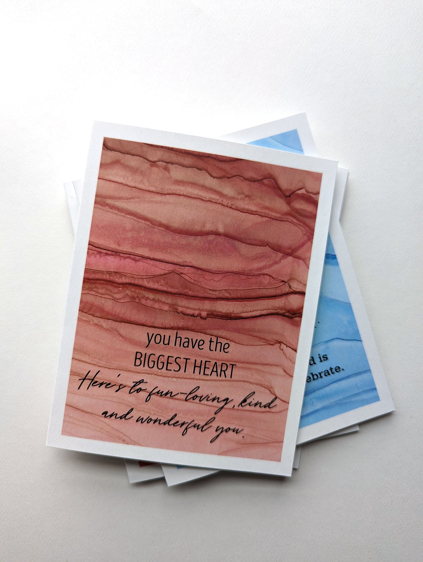Stack of greeting cards on a white background.