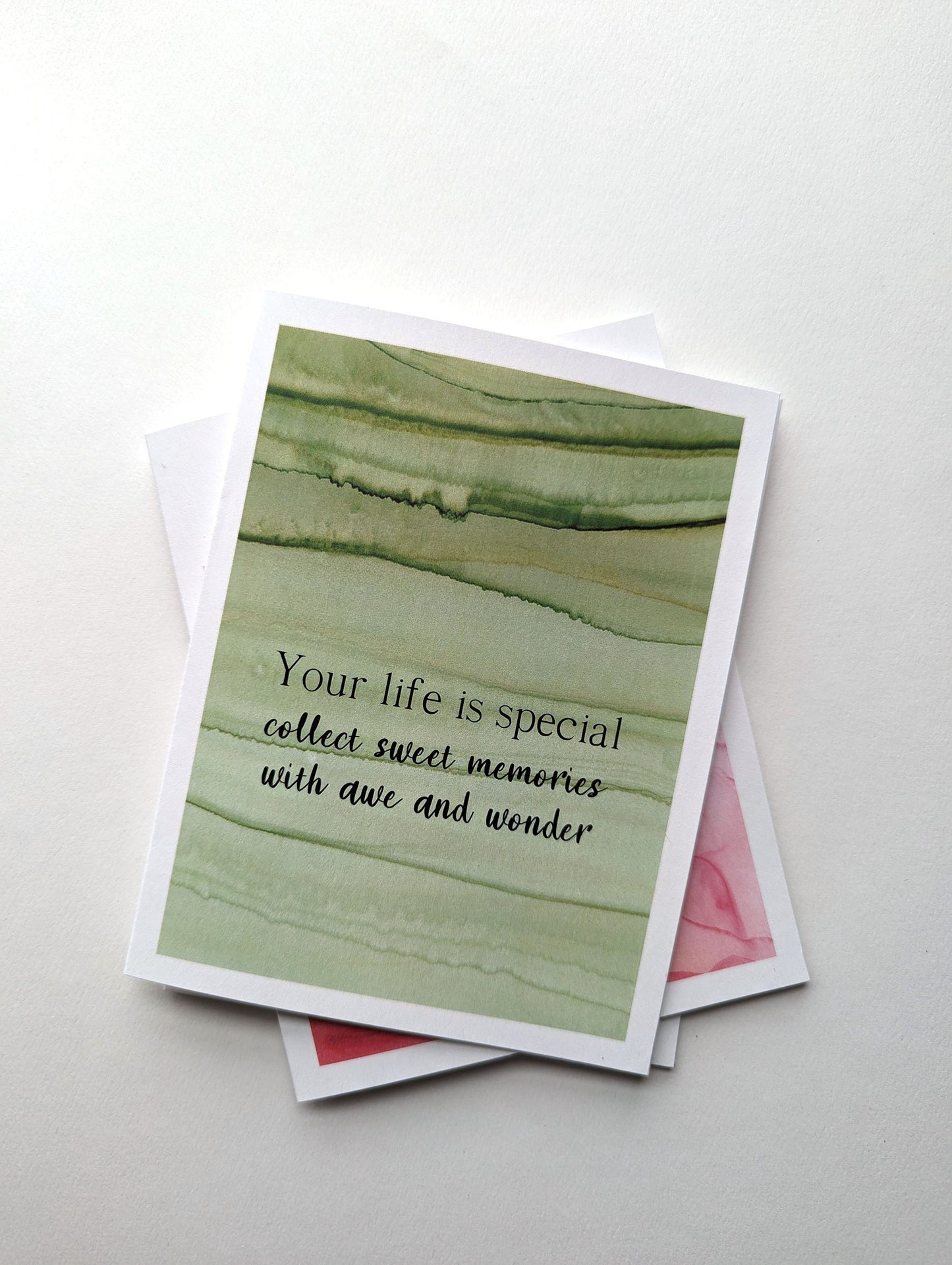 Stack of greeting cards on a white background.