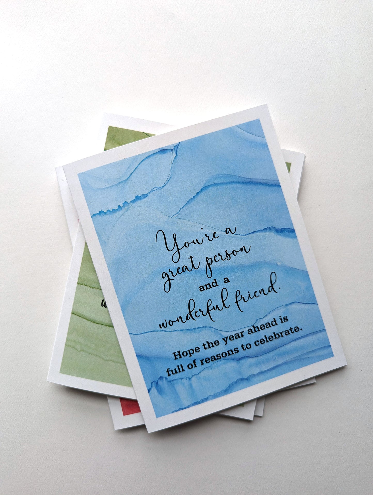 Stack of greeting cards on a white background.