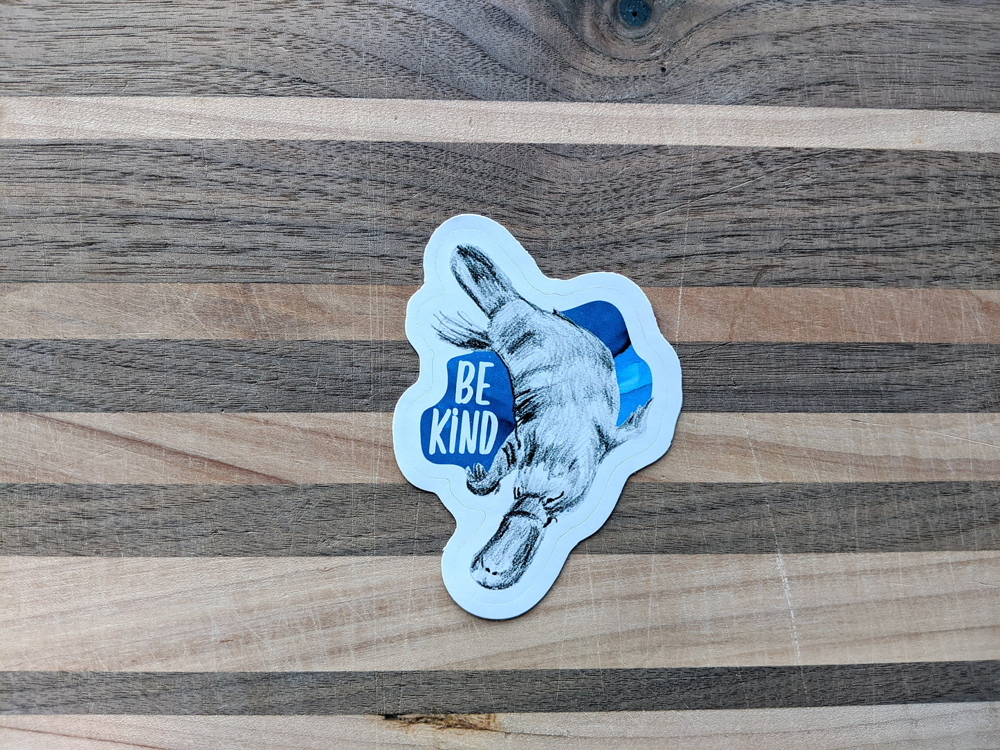 Sticker on a wooden surface.