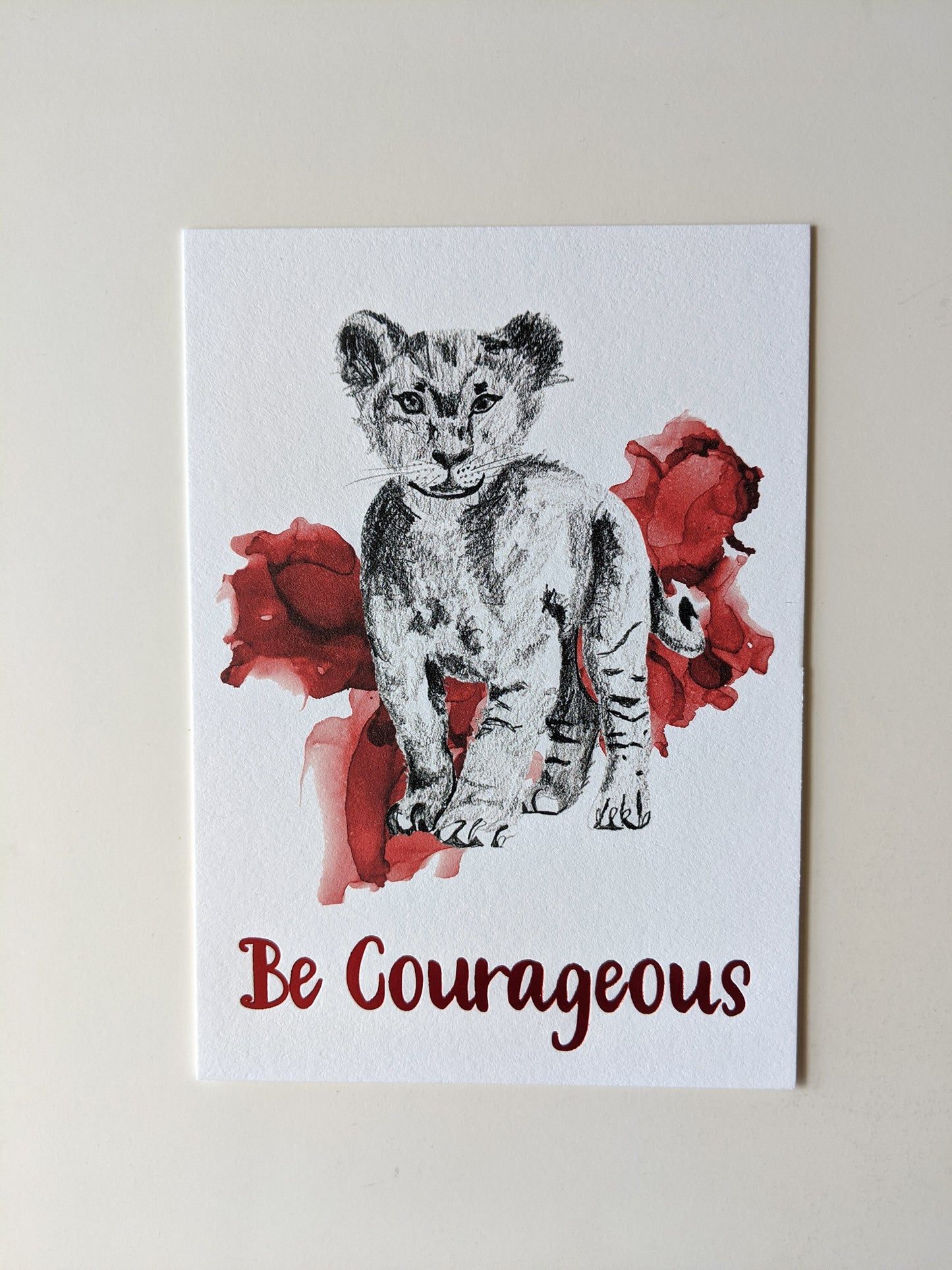 Art print accented in foil laying on a white background.
