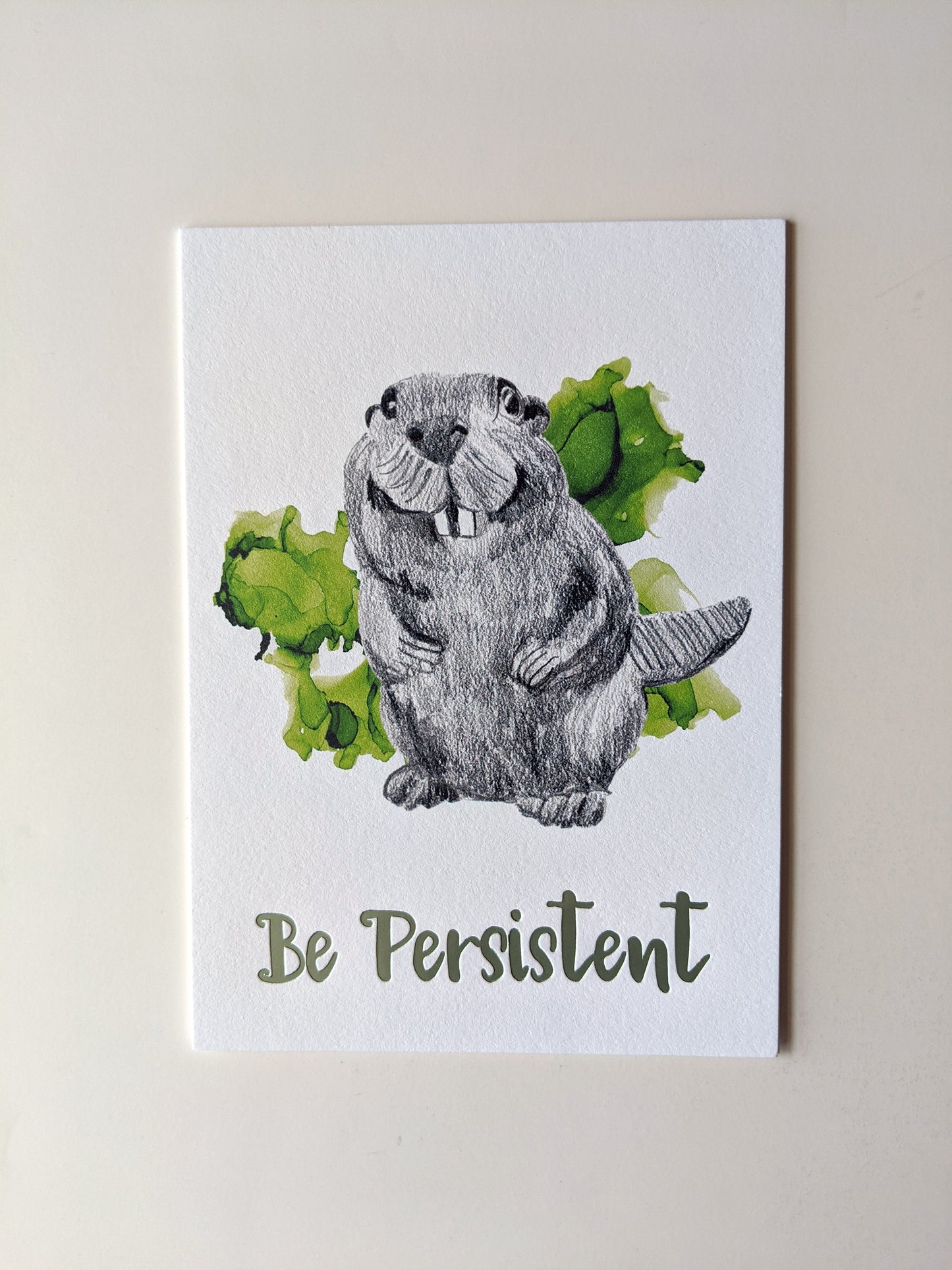 Art print accented in foil laying on a white background.