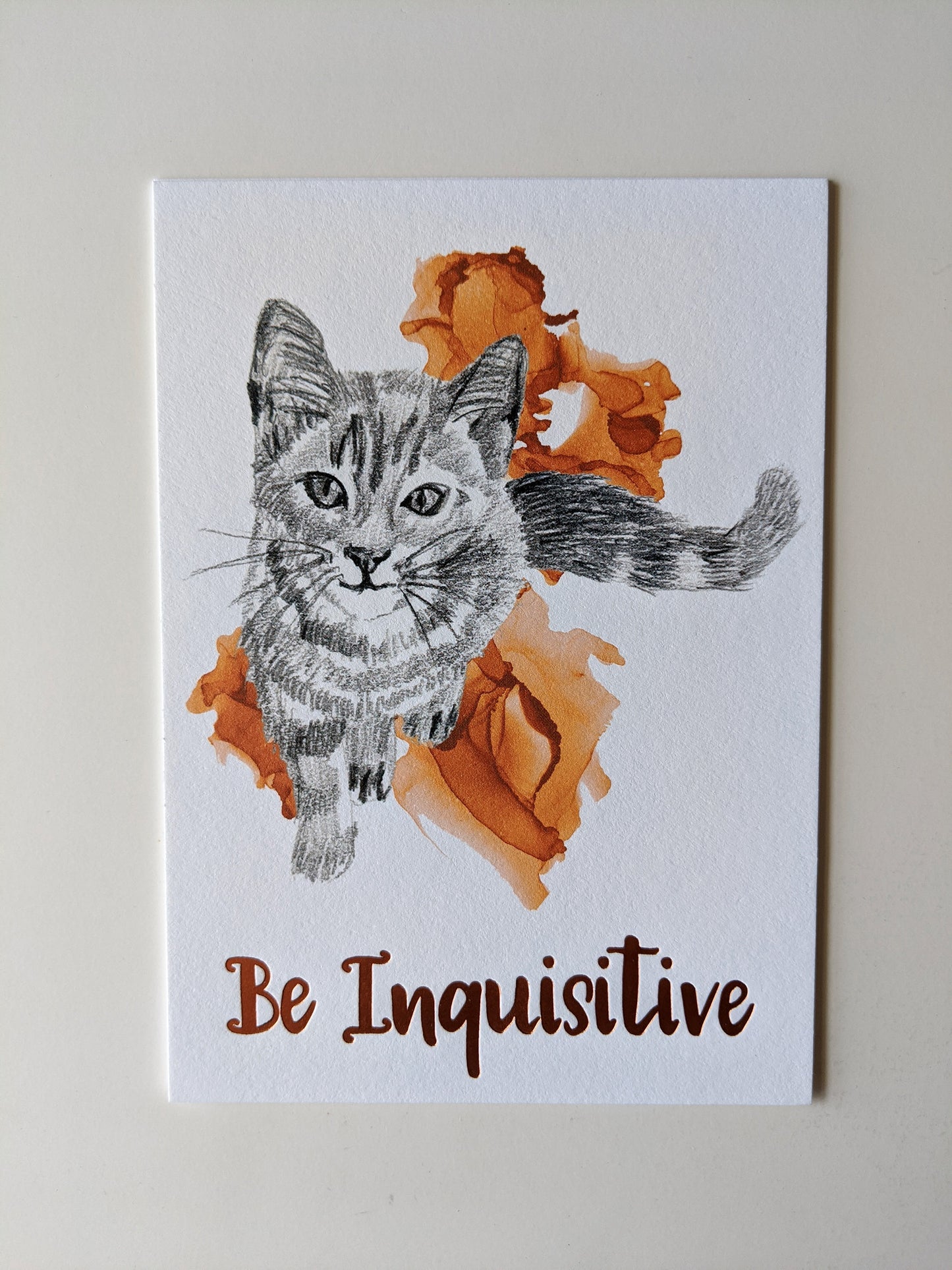 Art print accented in foil laying on a white background.