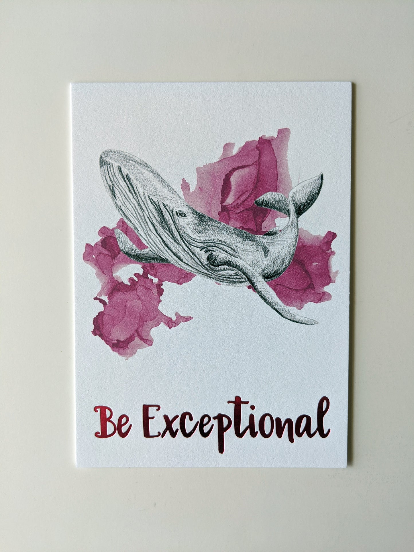 Art print accented in foil laying on a white background.