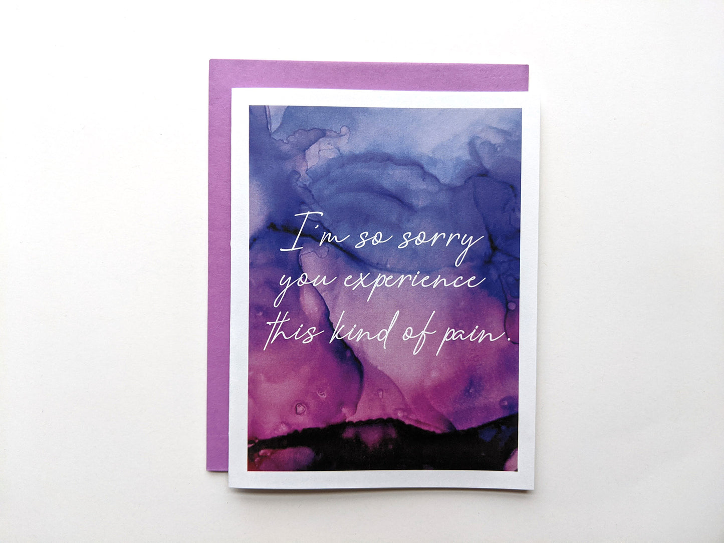 Greeting card with a colorful envelope on white background.