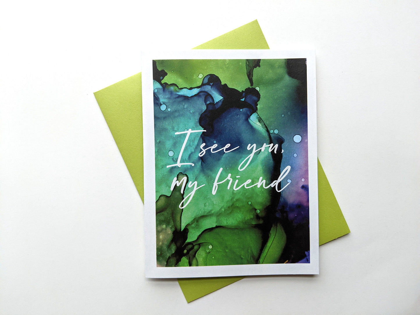 Greeting card with a colorful envelope on a white background.