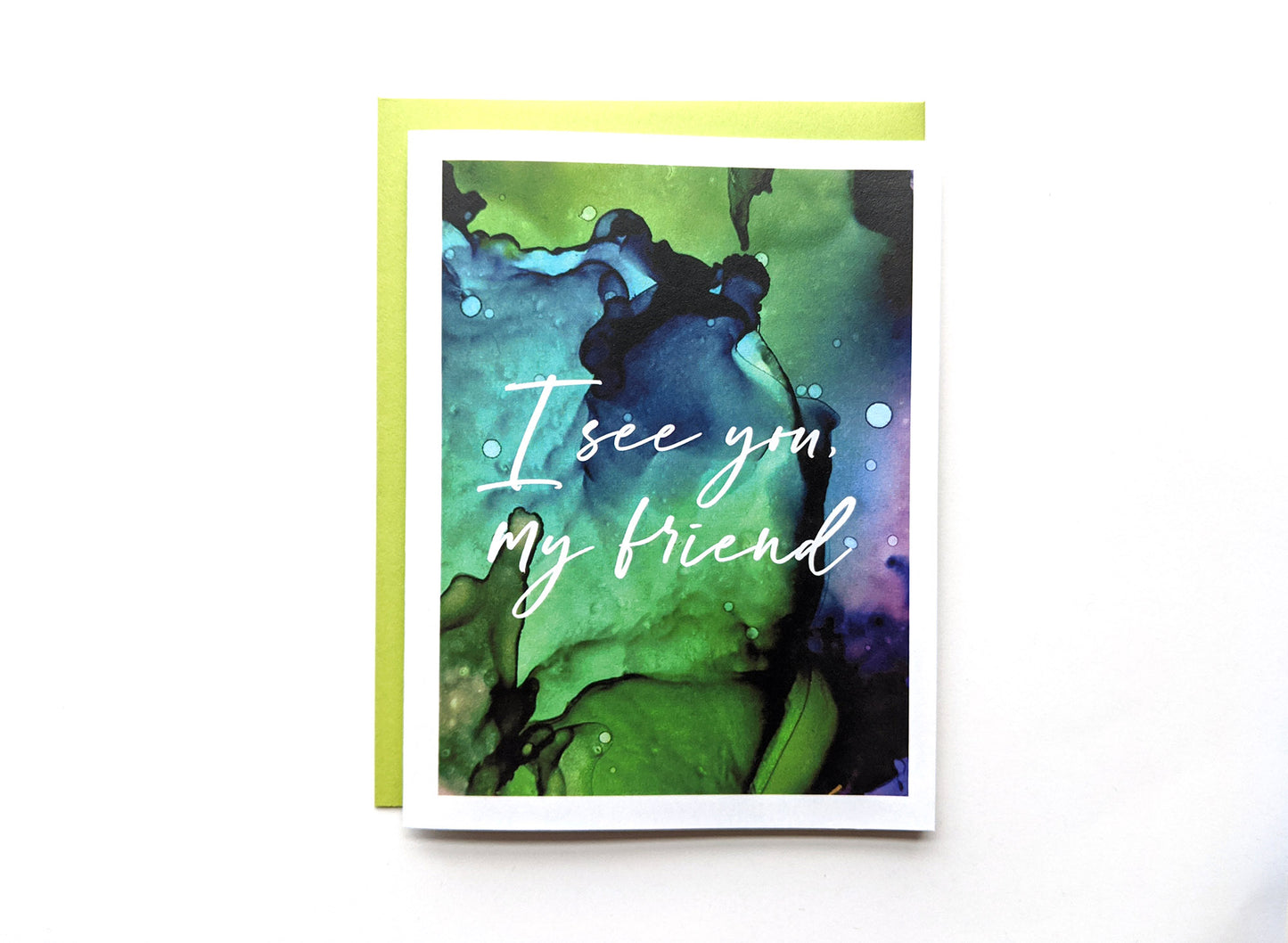 Greeting card with a colorful envelope on a white background.