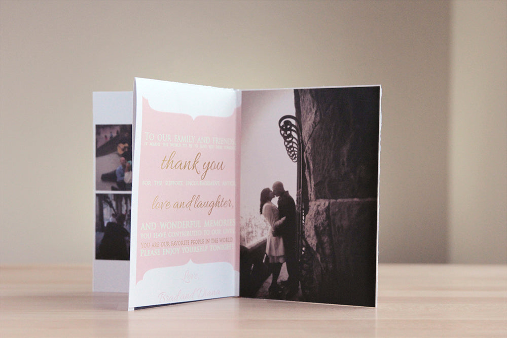 Centerpiece sitting on a wooden table with a neutral wall in the background. The panels show some candid snapshots of the couple, a thank you note to their friends and family, and a photo of them kissing along a stone balcony.