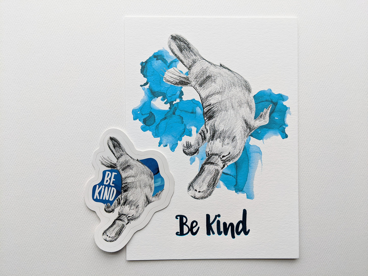 Art print and sticker on a white background.