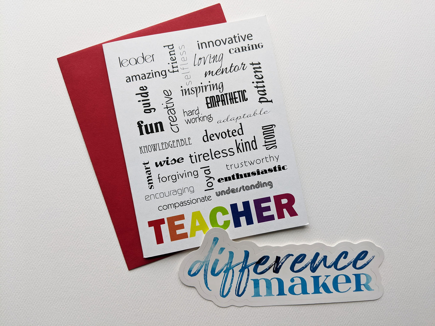 Greeting card, colored envelope, and sticker on a white background.