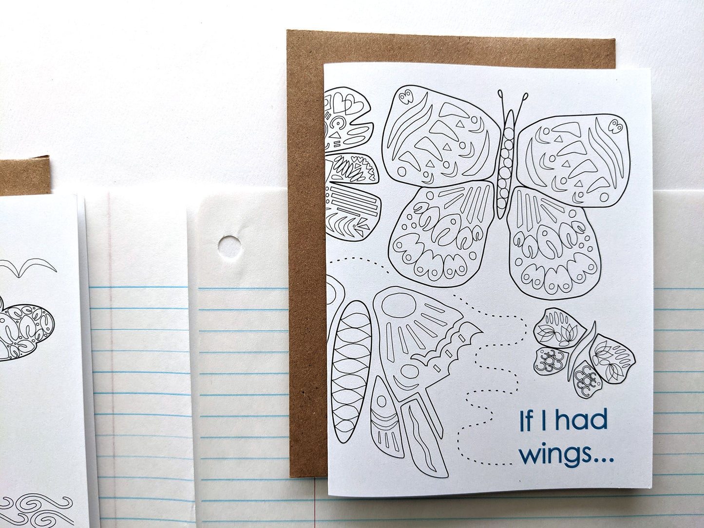 Greeting card laying on lined notebook paper.