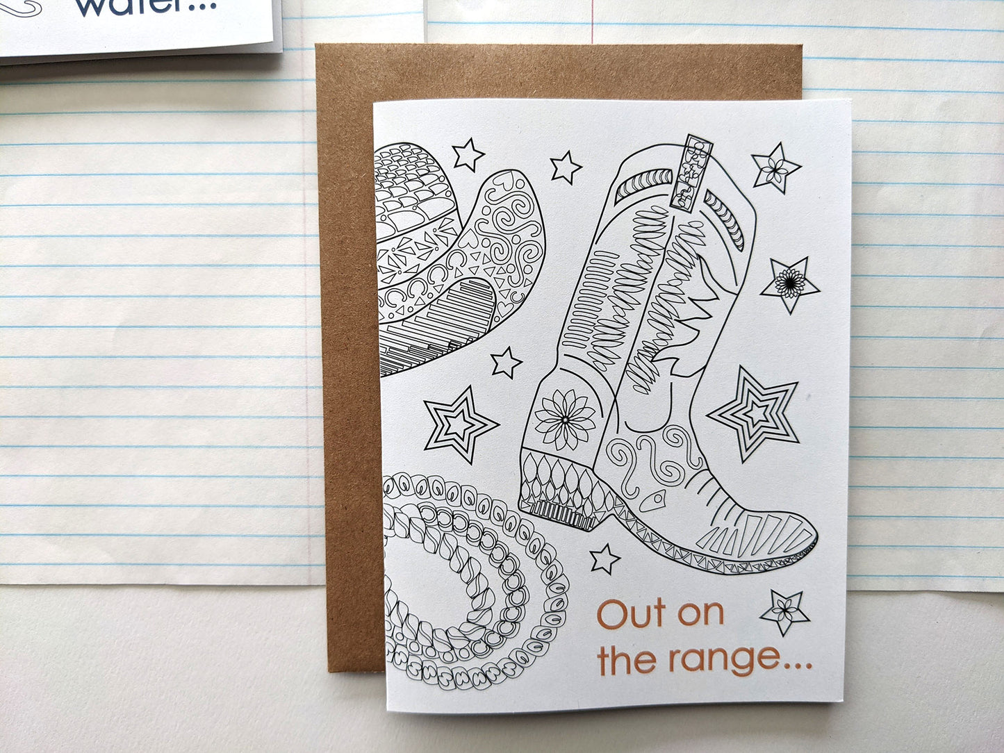 Greeting card laying on lined notebook paper.