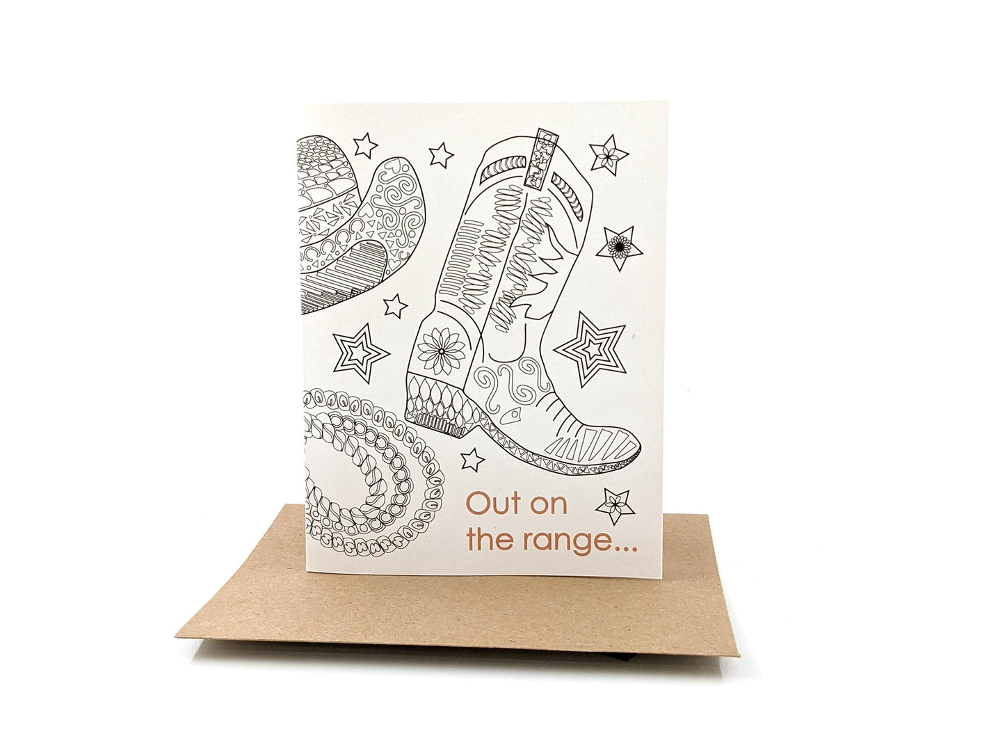 Greeting card standing upright on top of a kraft envelope against a white background.