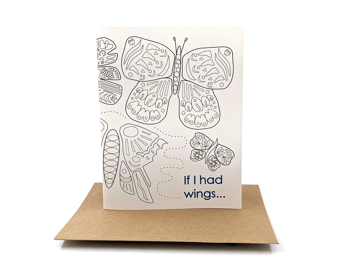 Greeting card standing upright on top of a kraft envelope against a white background.