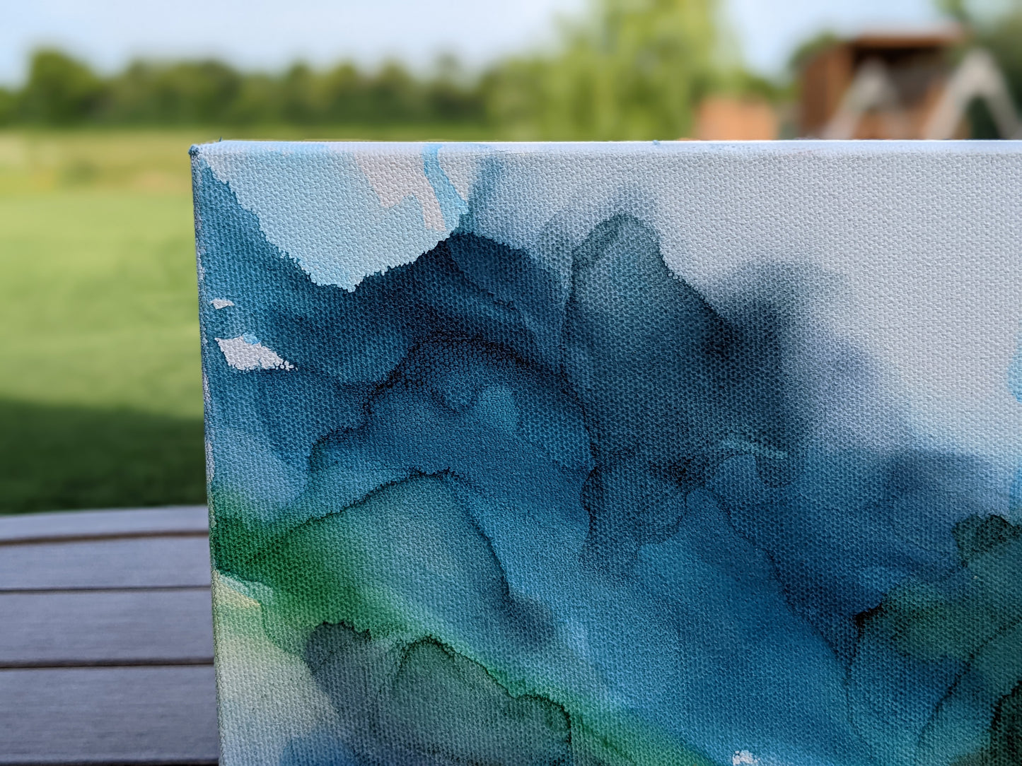 Zoomed in detail of painting outdoors.