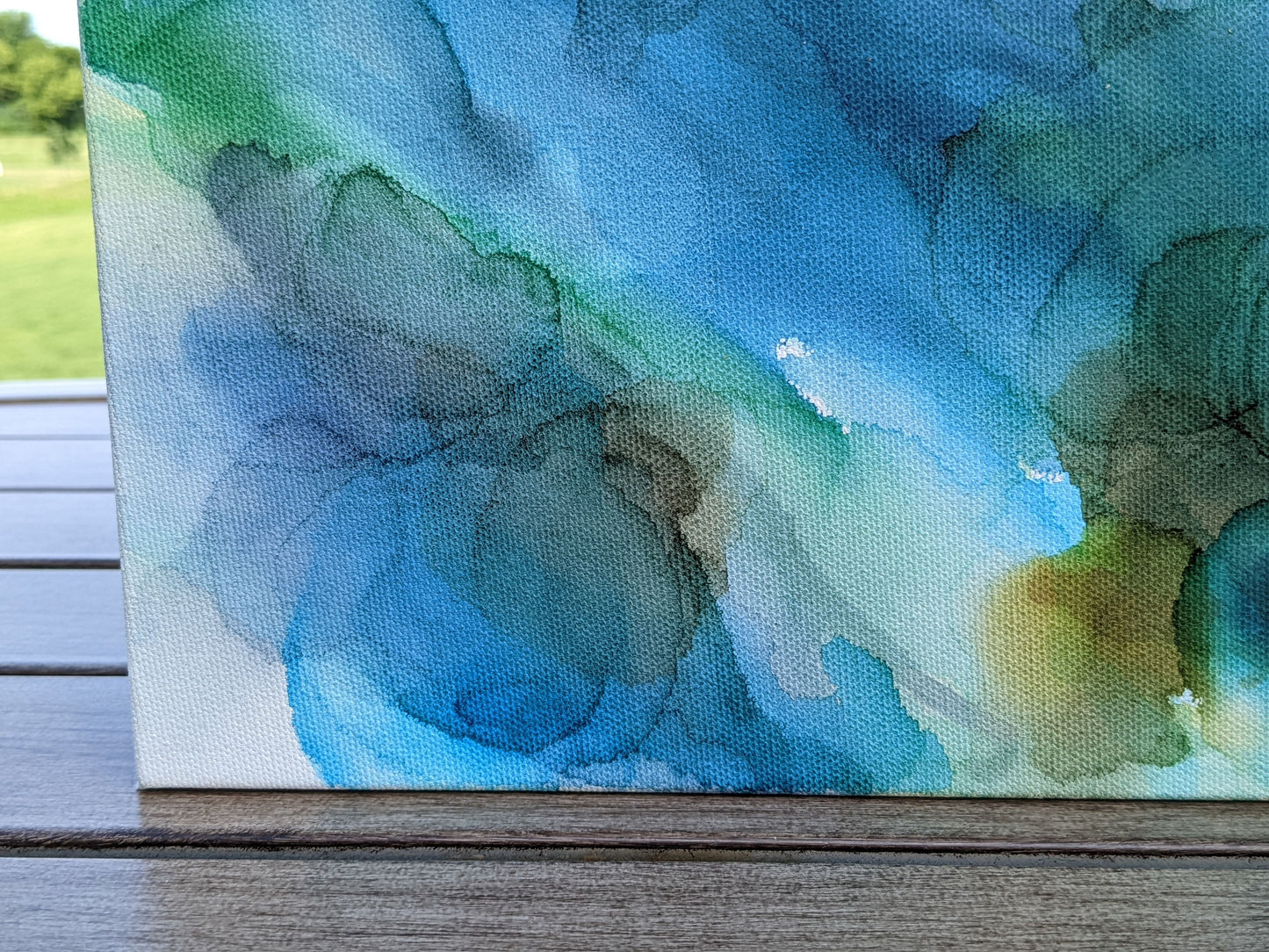 Zoomed in detail of painting outdoors.