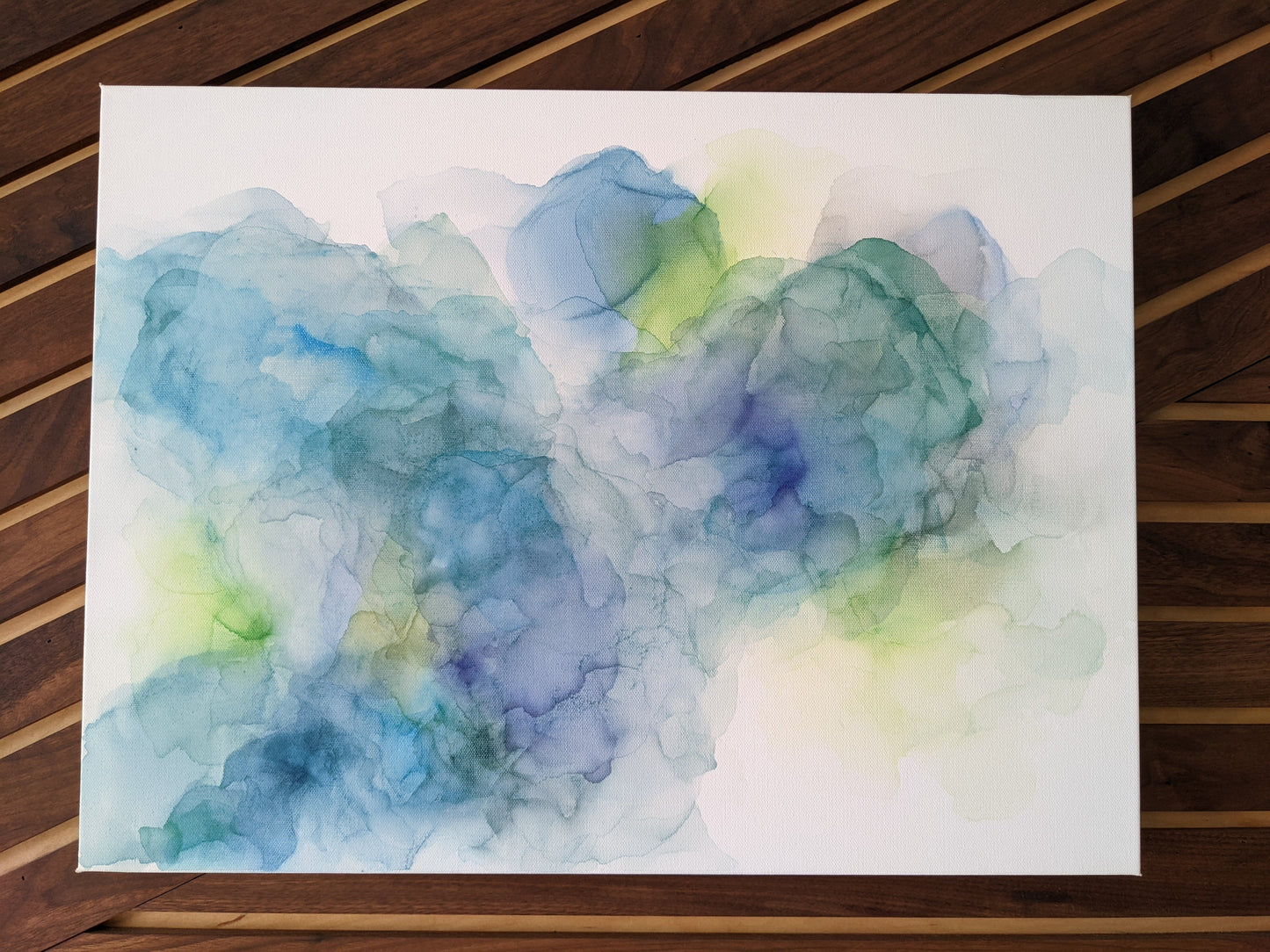 Zoomed in shot of canvas shown against a wood slat wall.