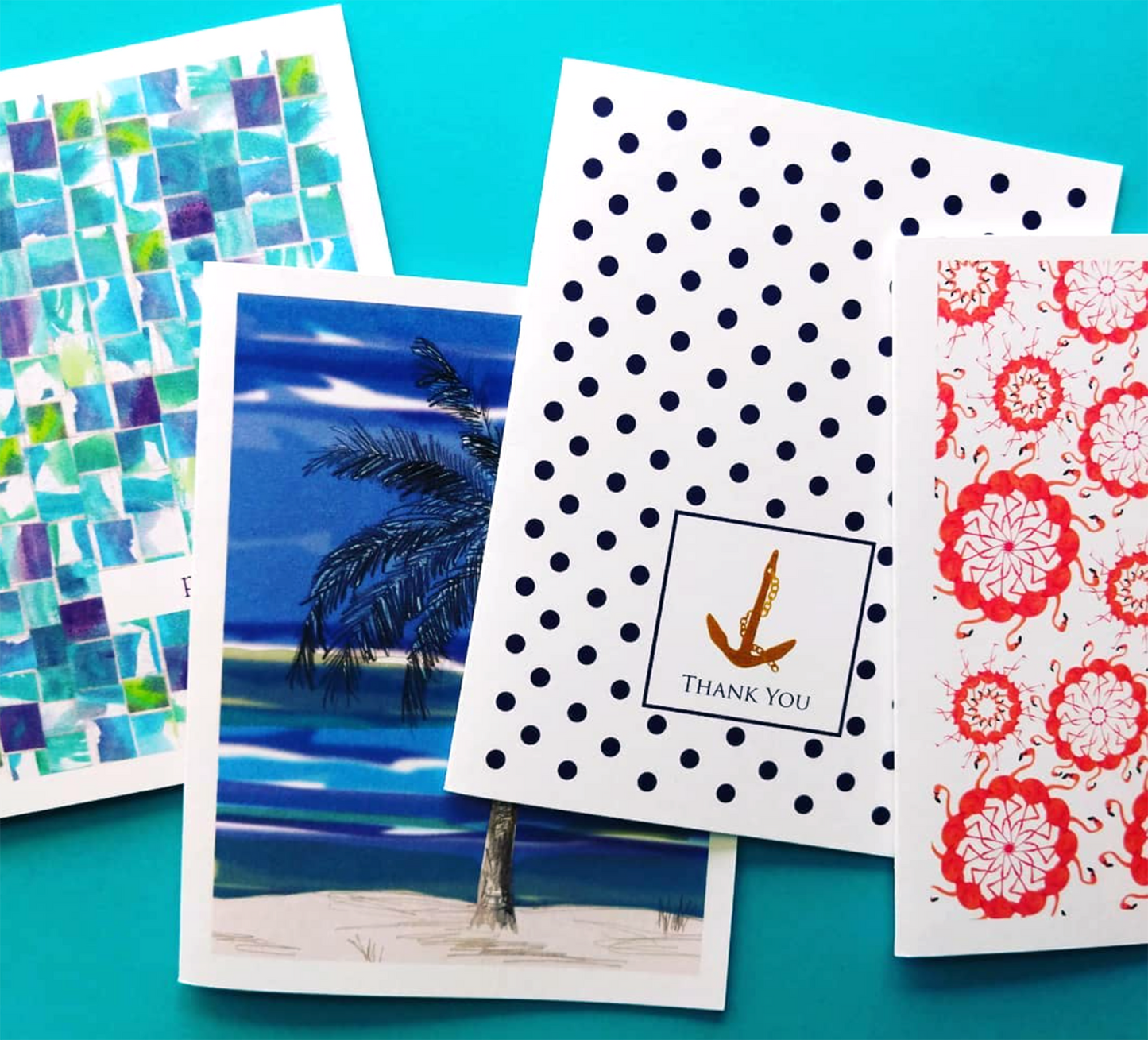 Four overlapping greeting cards on a blue background.