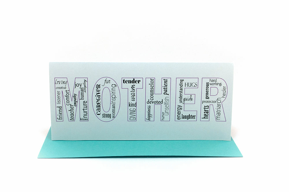 Greeting card standing upright on top of a colorful envelope against a white background.