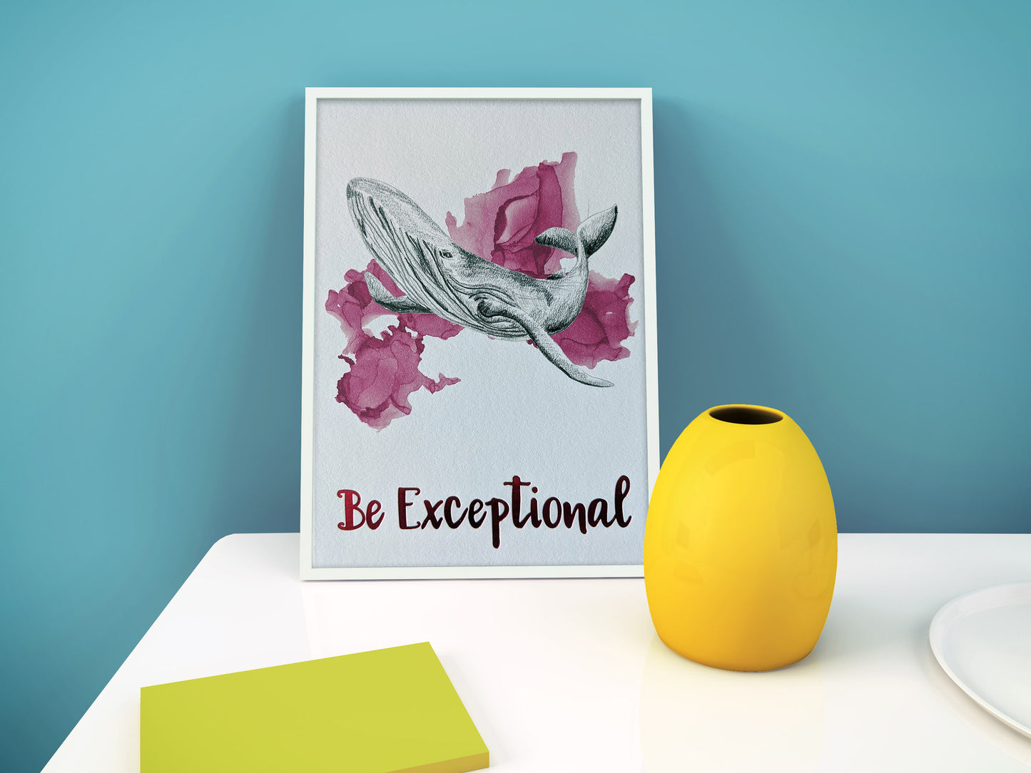 Digital mockup of an animal art print with foil accents framed in white leaning on a white surface against a teal wall. A yellow vase and bright greeen coaster are in the foreground.