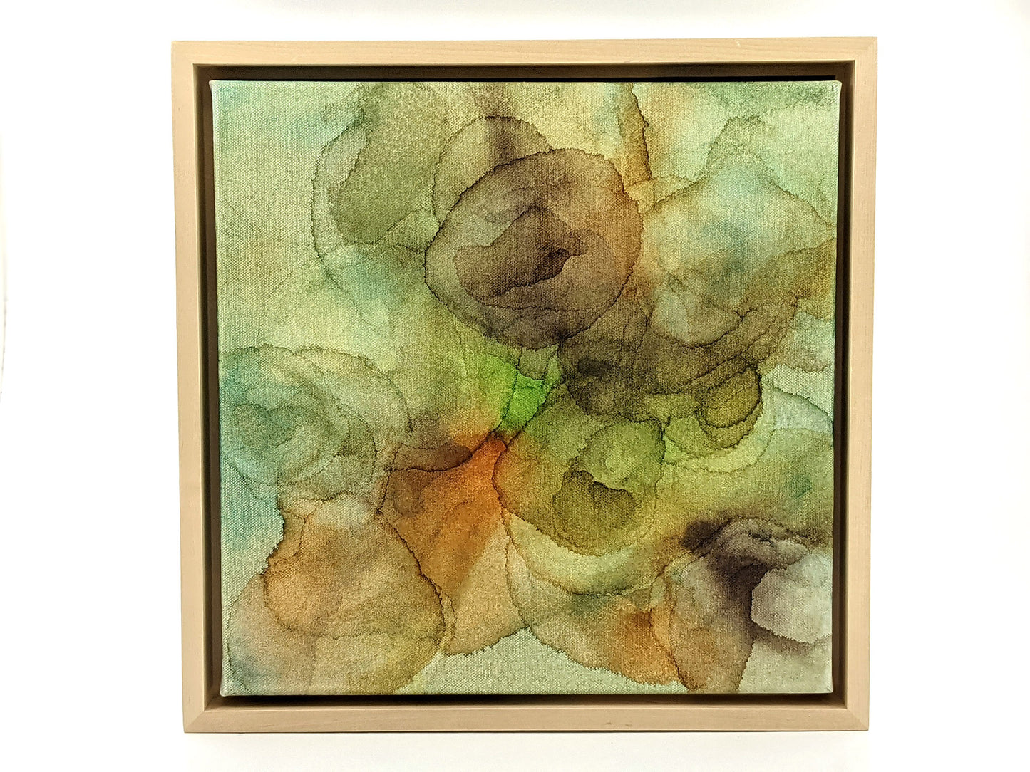 Front view of Backwoods in a light maple float frame.