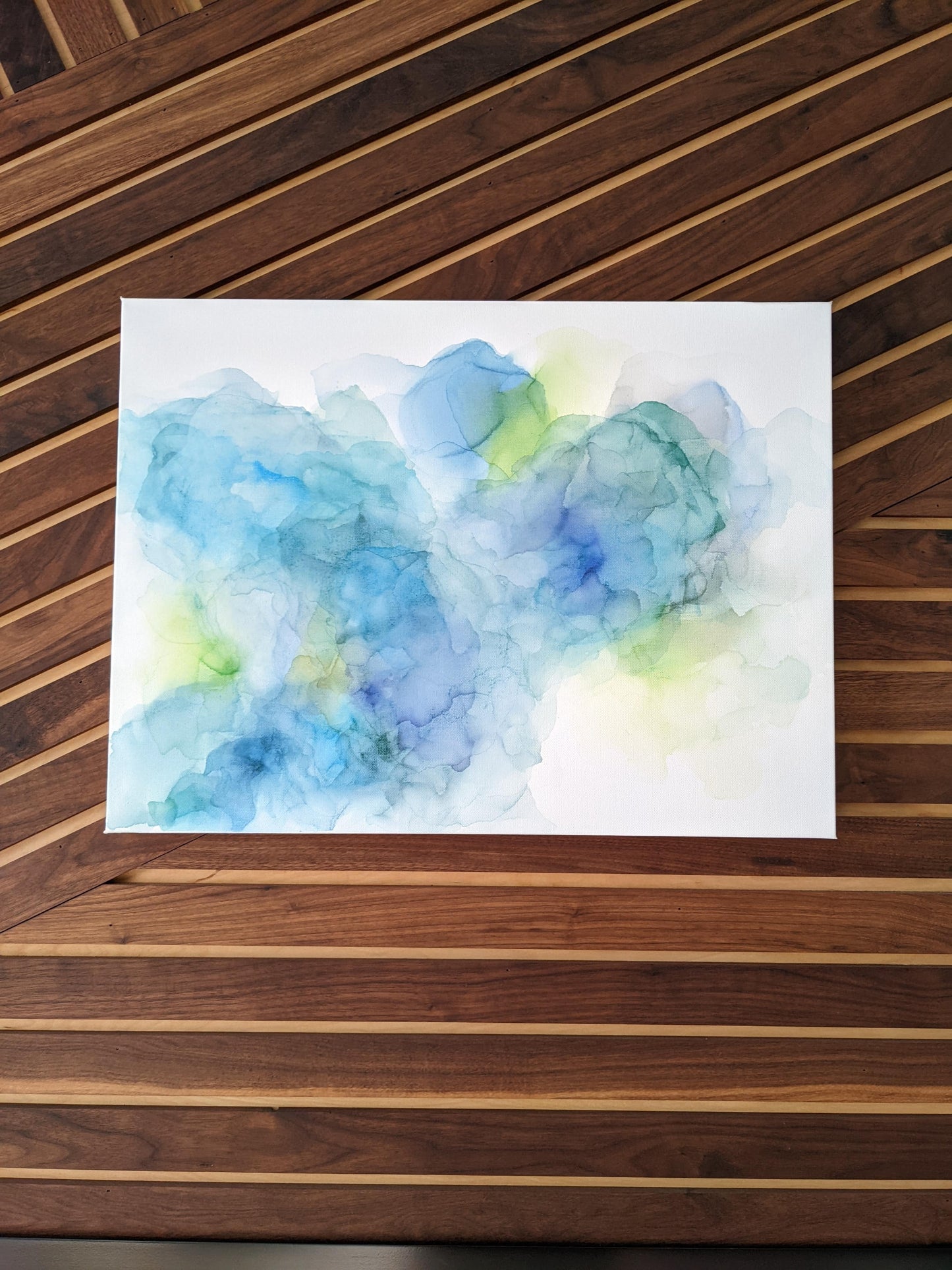 Zoomed in shot of canvas shown against a wood slat wall.