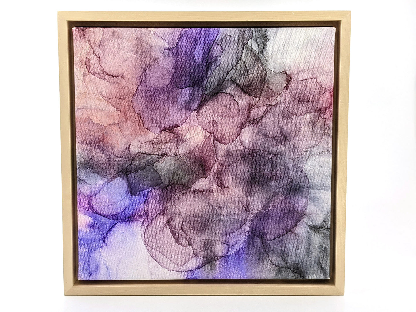 Front view of Flow in a light maple float frame.